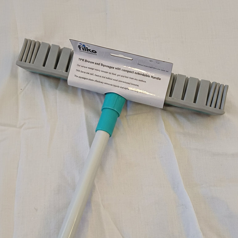 Gray broom with green handle and filko packaging on a white background