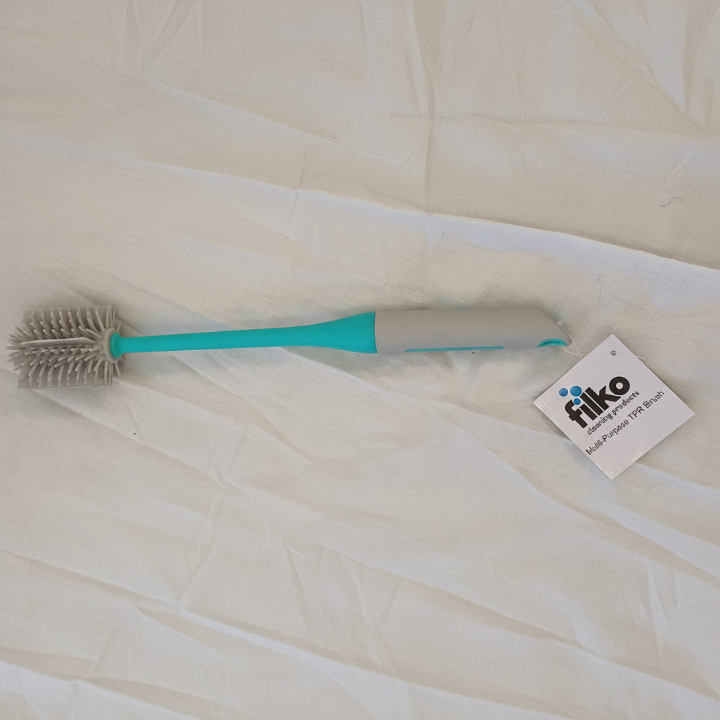 Bottle brush with a blue handle on a white background, featuring a FUKO label.